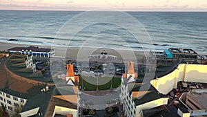 Drone view of the Atlantic Ocean and the Pier Village in Long Branch, New Jersey, at sunset