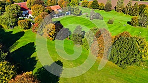 Drone view of autumn golf course in Germany.