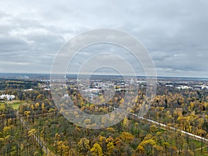 Drone view of autumn suburban parks of St. Petersburg with palaces on a cloudy day