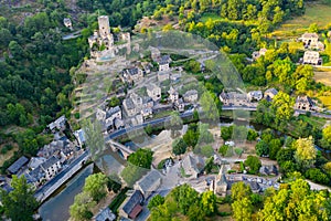 Drone view of Belcastel village overlooking fortified castle, France