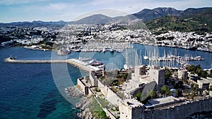 Drone view on Bodrum harbour and ancient Kalesi castle.