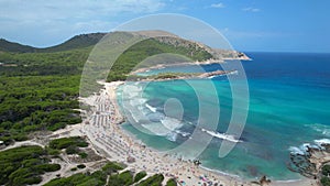 Drone view of Cala Agulla beach in Mallorca, Spain, on a hot summer day