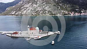 Drone view of the Church of Our Lady of the Rocks and Island of Saint George, Bay of Kotor near Perast