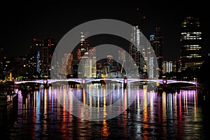 Drone view of the cityscape of London with a Lambeth Bridge reflected in the Thames river at night