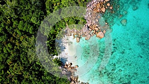 Drone view Couple on beach of Anse Lazio Praslin island Seychelles,Secret small beach of Anse Petite