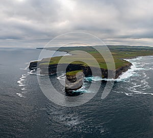 Drone view of the Downpatrick Head sea stack and cliffs and coastline of northern County Mayo in Ireland