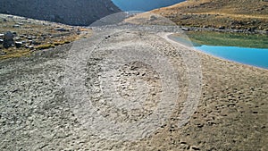 Drone view of a dried-up riverbed in the mountains