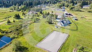 Drone view of farm house and green pastures photo