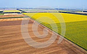 Drone view of a farmer plowing his field.