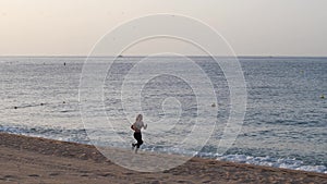 Drone view of fit woman during speed run on beach