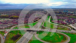 Drone view of high-speed interchange in North America: pulsating heartbeat of highway system from above. picturesque