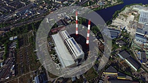 Drone view industrial chimney on power plant on urban landscape