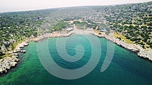 Drone view of lagoon, turquoise colored waters at Maiden Hamam. Aerial footage shows lagoon, turquoise colored against