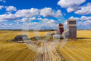 Drone view of the Lepine Grain Elevators in the yellow fields under the sunlight