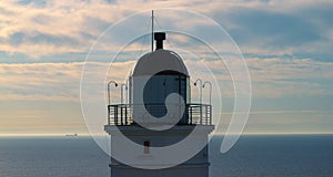 Drone view lighthouse on coastline at morning sunrise. Panoramic view seascape.