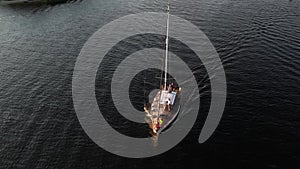 Drone view of luxury boat cruising in high speed in blue sea