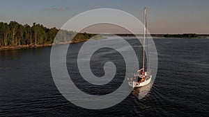 Drone view of luxury boat cruising in high speed in blue sea