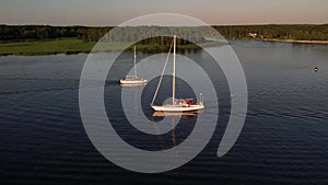 Drone view of luxury boat cruising in high speed in blue sea