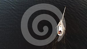 Drone view of luxury boat cruising in high speed in blue sea