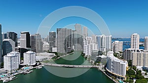 Drone view on Miami skyline with downtown residential, modern buildings and road bridge across water. Wonderful