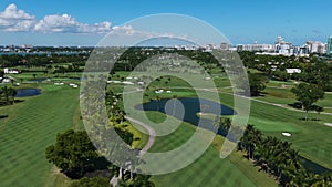 Drone view on most exclusive country club, La Gorce Club in Miami. Spectacular scenery of big golf course among ponds