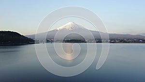 Drone view of Mountain Fuji reflected in Kawaguchiko lake on a sunny day and clear sky