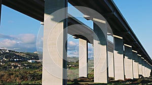 Drone view of mountain viaduct on expressway. Highway, viaduct in natural landscape. Stunning highway, viaduct aerial