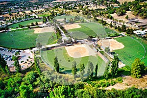 Drone view of a multi-use playfield with football and softball diamonds