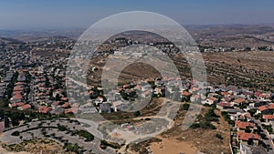 Aerial footage over Israeli Jewsih Settlement Har hadar and Arab Palestinian Village