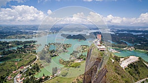 Drone view overlooking the PeÃ±Ã³n of GuatapÃ© rock in Colombia