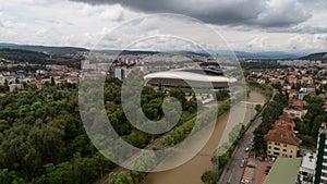 Drone view of a park and a river on a cloudy day