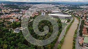 Drone view of a park and a river on a cloudy day