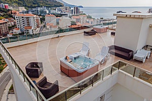 Drone view. Portrait of young carefree happy smiling woman relaxing at hot tub during enjoying happy traveling moment