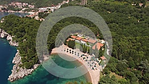 Drone view of Queens Beach with parasols and sun loungers near Milocer Villa