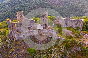 Drone view of remains of Chateau Rocher on cliff, France