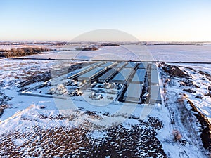 Drone view of a rental storage unit facility with closed bay doors. photo