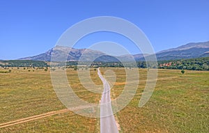 Drone view of the road at the bottom of Dinara Mountain