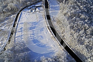 drone view with road and forest in winter
