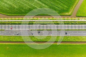 Drone view of a road in the middle of a field. Landscape from a drone. Road and transport.