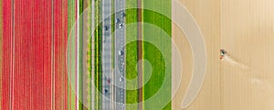 Drone view of a road in the middle of a field. Landscape from a drone. Road and transport. Agricultural transport.
