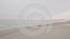 Drone view of sandy empty beach on a sunset, Portugal