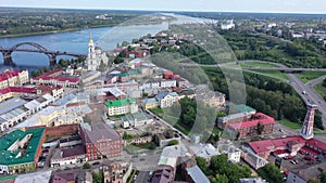 Drone view of the small Russian city of Rybinsk with the longest and original bridge over the Volga River on a summer