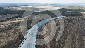 Drone view on spring thaw and Desna river in Ukraine. Bird's eye view of the river in ice in early spring