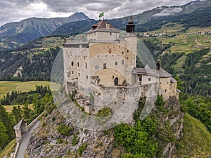 Drone view at Tarasp castle in the Swiss alps