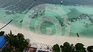 Drone View of Tropical Resort on Beautiful Beach. Aerial Shot of Turquoise Sea