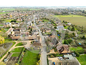 Drone view of a typical main road interesting an English village.