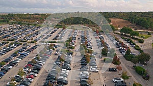 Drone view urban parking full of vehicles. Crowded city carpark at shopping mall