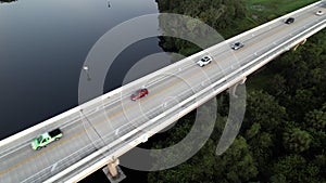 Drone view of vehicles driving over the Fort Hamer Bridge