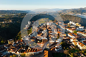 Drone view of Vila Real cityscape with viaduct crossing Corgo River in background