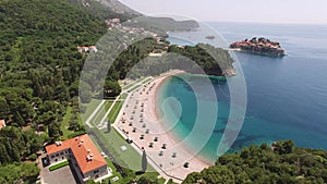 Drone view of Villa Milocer near Queens Beach against the backdrop of Sveti Stefan Island